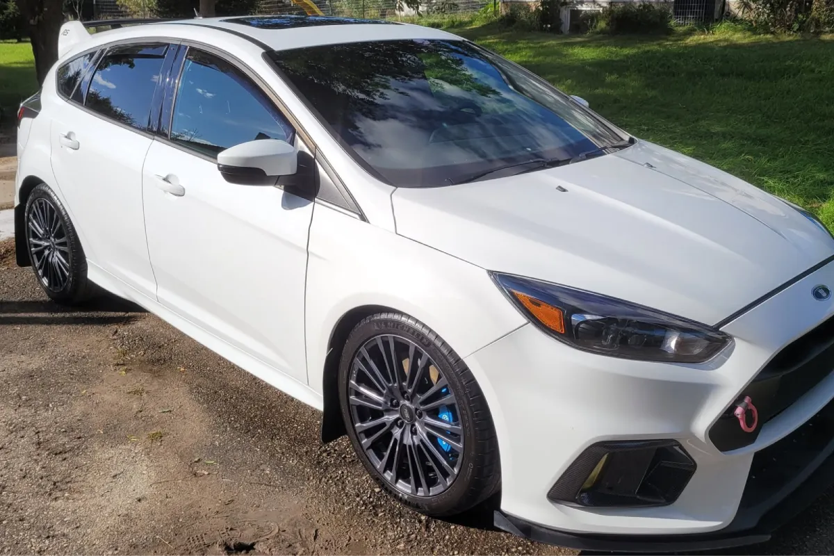 White Ford Focus showcasing ceramic coating protection.