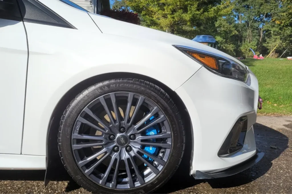 White Ford Focus with a glossy ceramic coating finish.